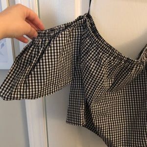 Checkered off-the-shoulder top.
